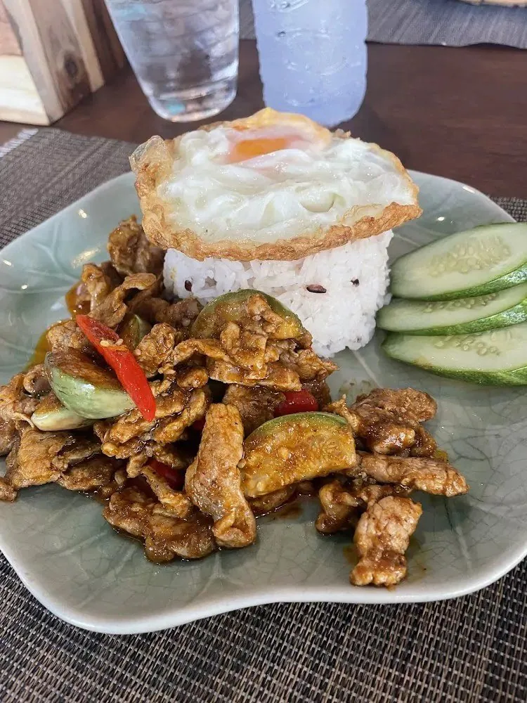 Pad kra pao with rice and a fried egg